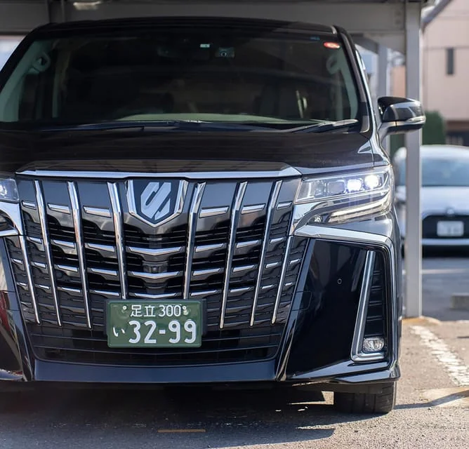 Door-to-door transfer Haneda to Tokyo hotel — private car at designated airport pickup point